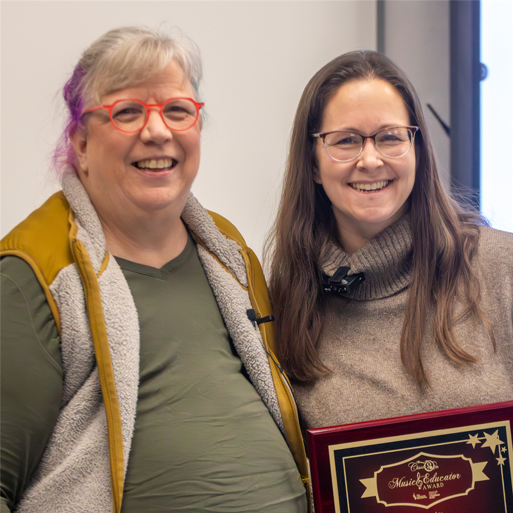  Teacher Joanna Kuf smiles after receiving an award